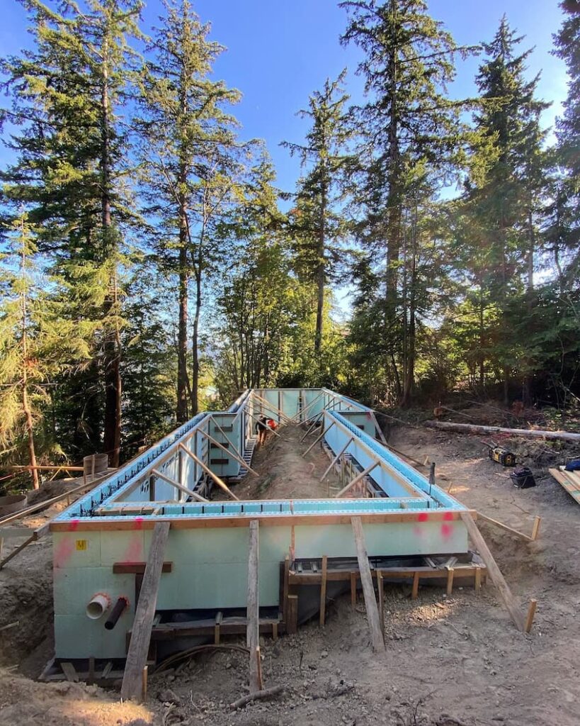 A photo of a small foundation footprint, where the ICF blocks are all installed and braced, ready for the concrete pour.