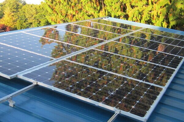 Net zero energy vs carbon neutral
A photo of a solar array on a metal roof.